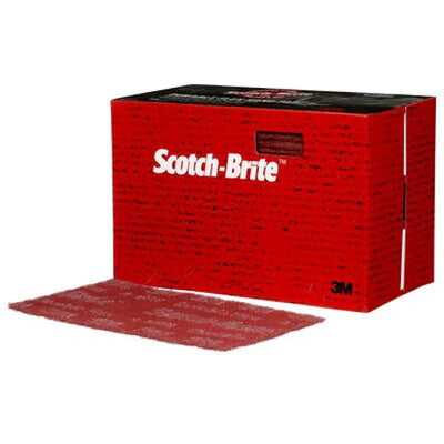 Red box of Scotch-Brite scrub pads with a single pad in front on a white background