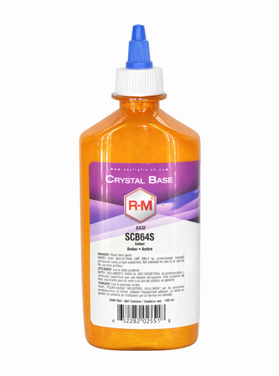 Orange bottle with a blue cap labeled 'R-M Crystal Base' on a white background