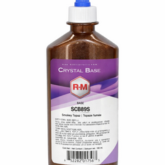 Bottle of RM Crystal Base with a purple label on a white background