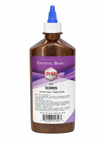 Bottle of RM Crystal Base with a purple label on a white background